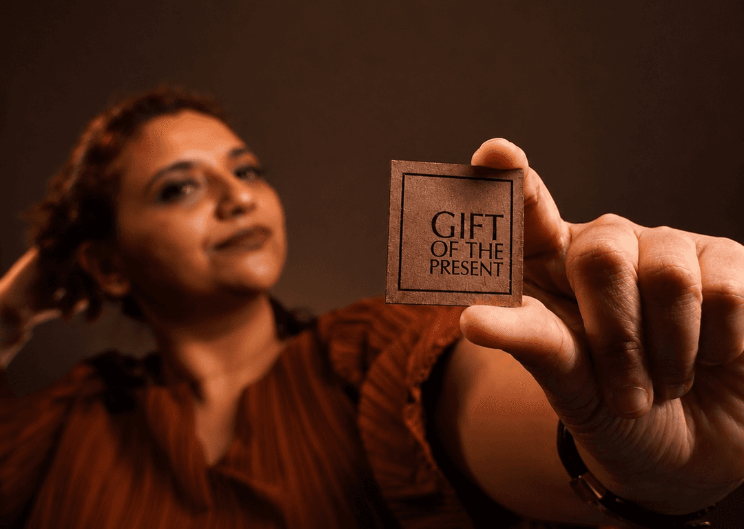 Abila Joseph presenting the Gift Of The Present mark